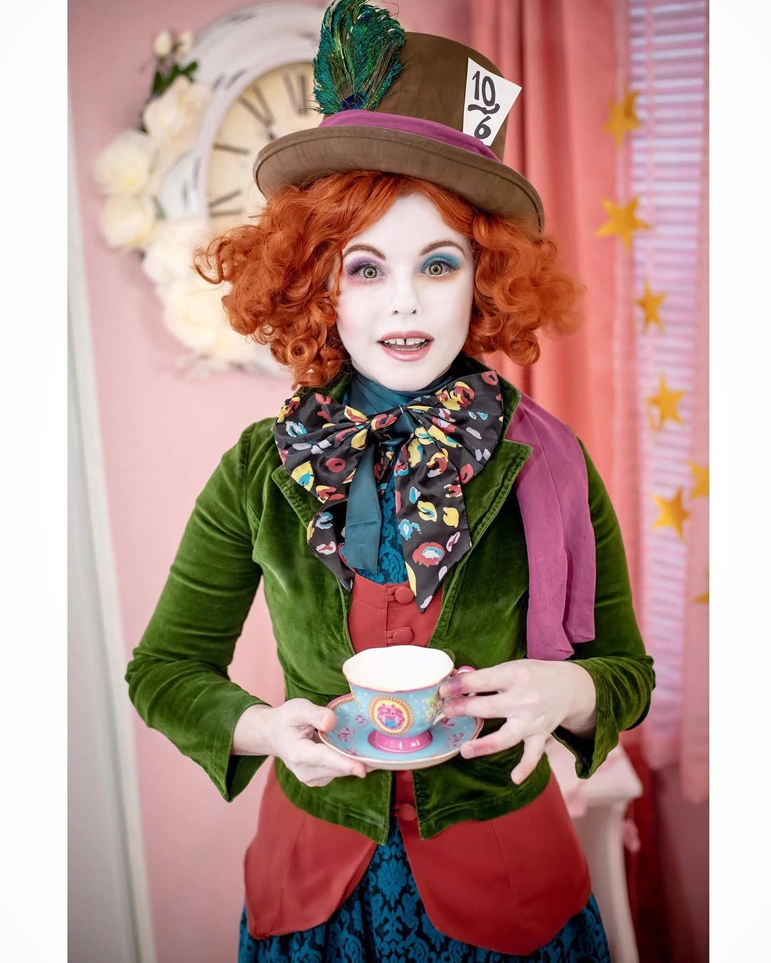 Green velvet hatter-inspired costume with scarf and tall hat