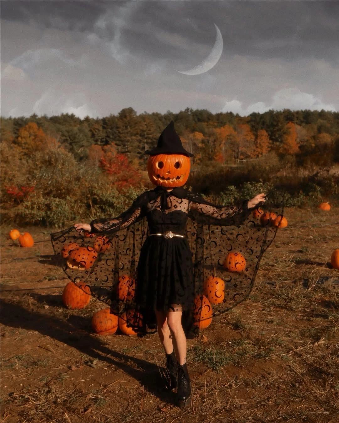 Pumpkin head costume with black lace dress and ankle boots