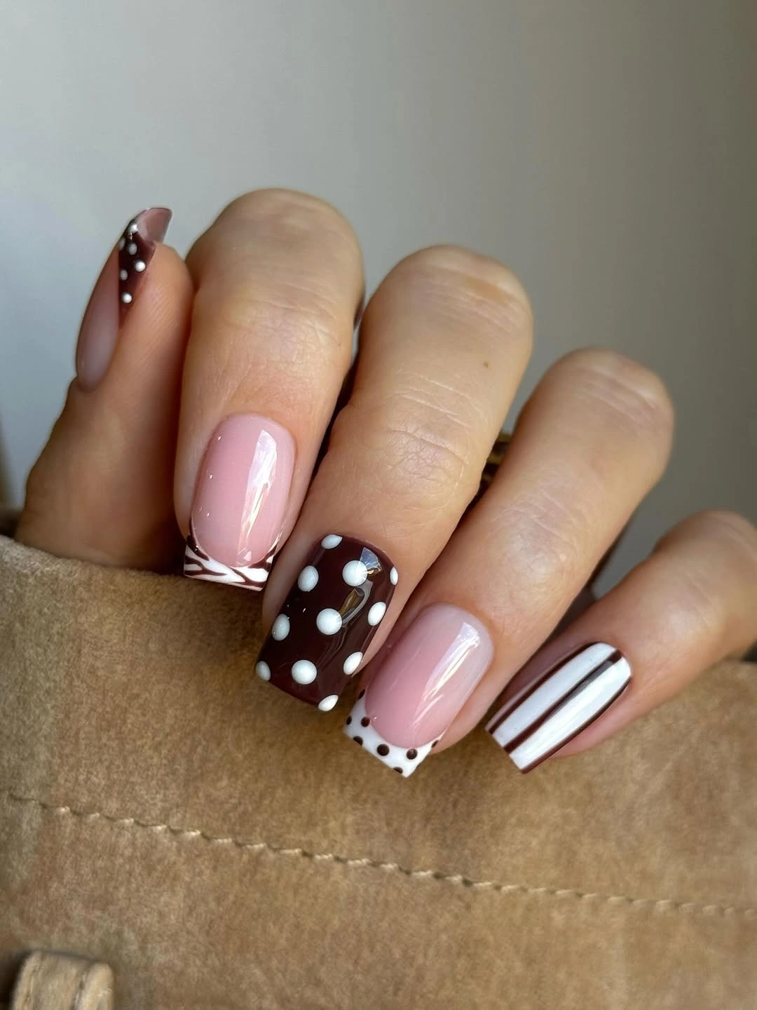 Pink square nails with brown micro-art white bands and dots