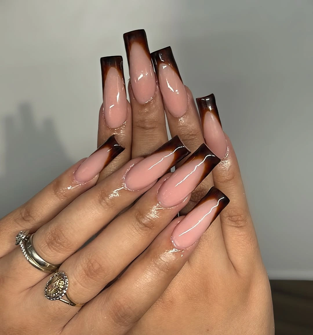 Mauve almond nails with glossy chocolate French tips