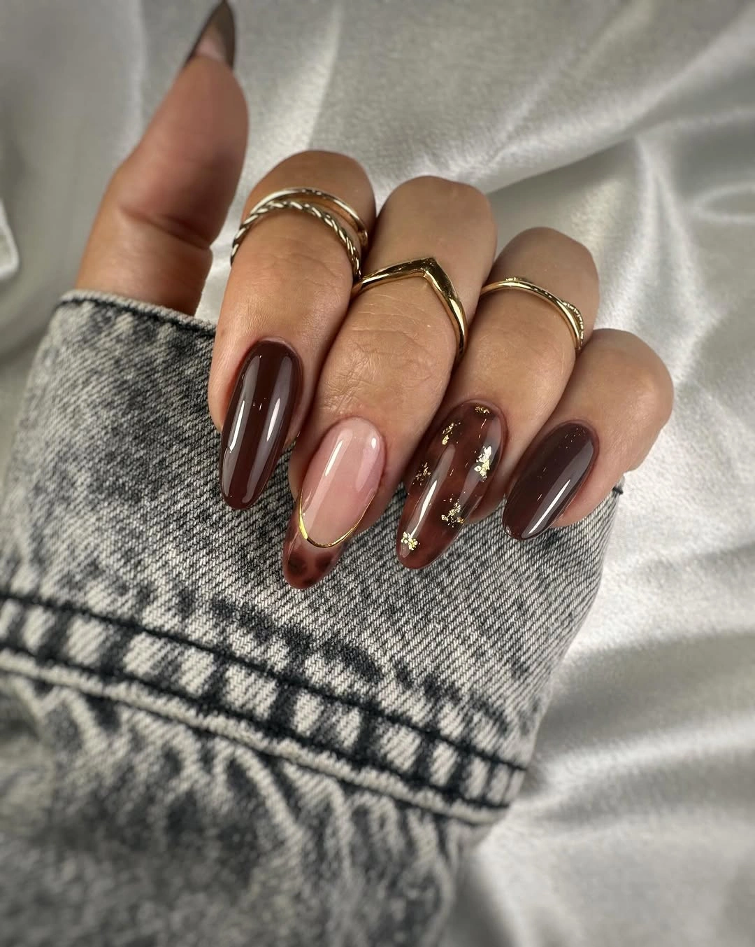 Chocolate almond nails with restrained copper sparkle details