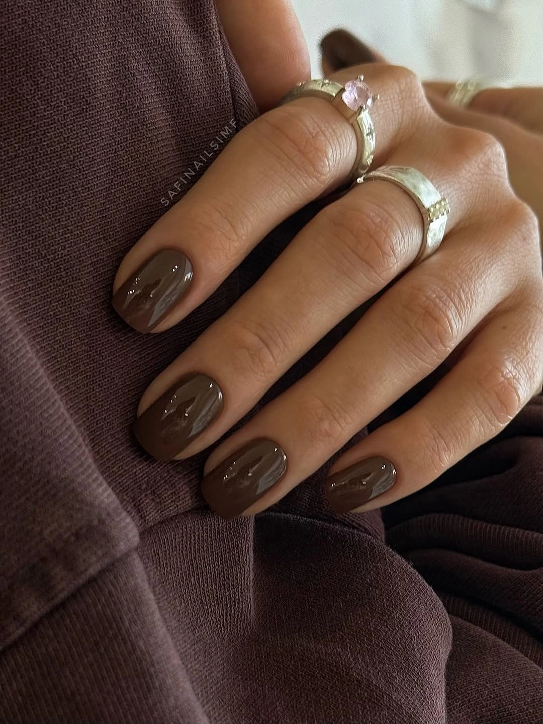 Short oval nails in glossy chocolate brown