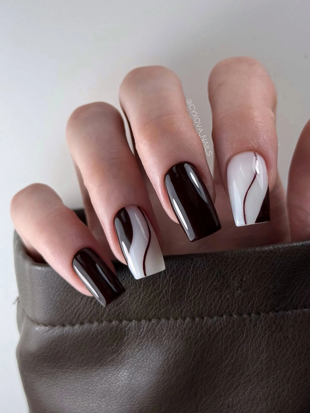 Brown white and black square nails with abstract lines