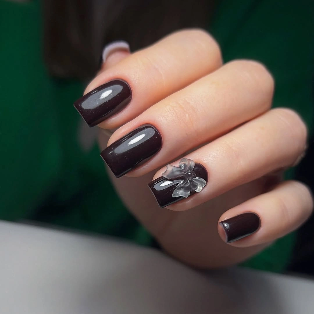 Deep plum square nails with one silver sculptural accent