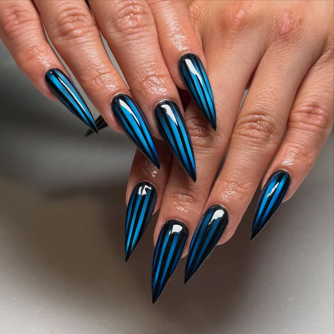 Saturated navy blue rounded-square nails with glossy shine