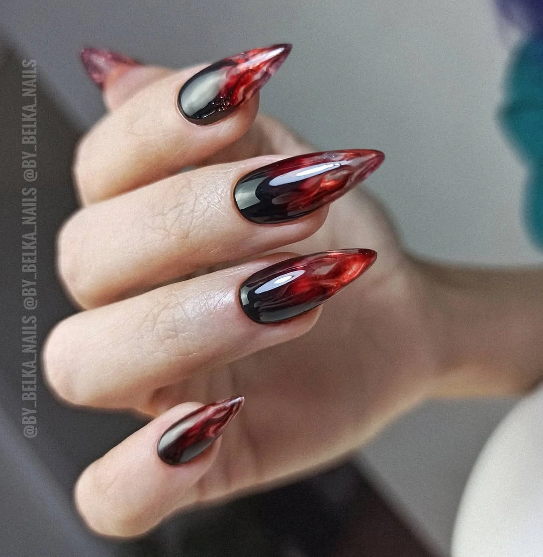 Black burgundy pointed nails with bright red curved outlines