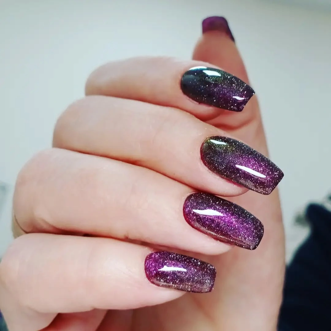 Saturated purple glitter on short square nails