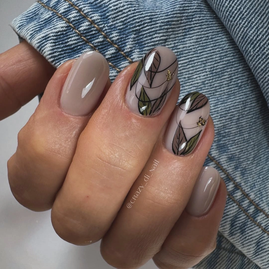 Sheer taupe nails with delicate black botanical lines