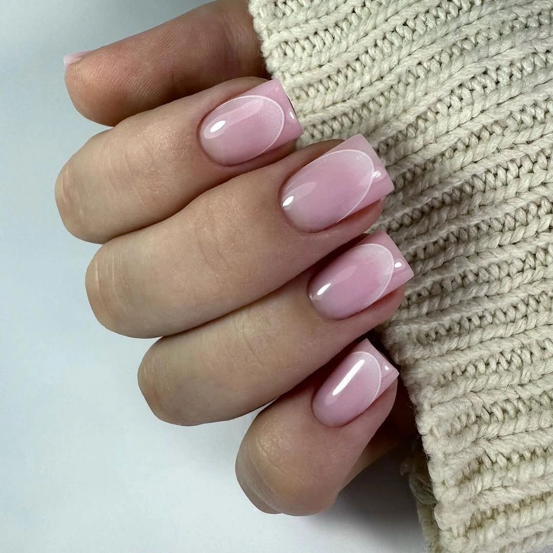 Milky pink rounded nails with a clean glossy finish