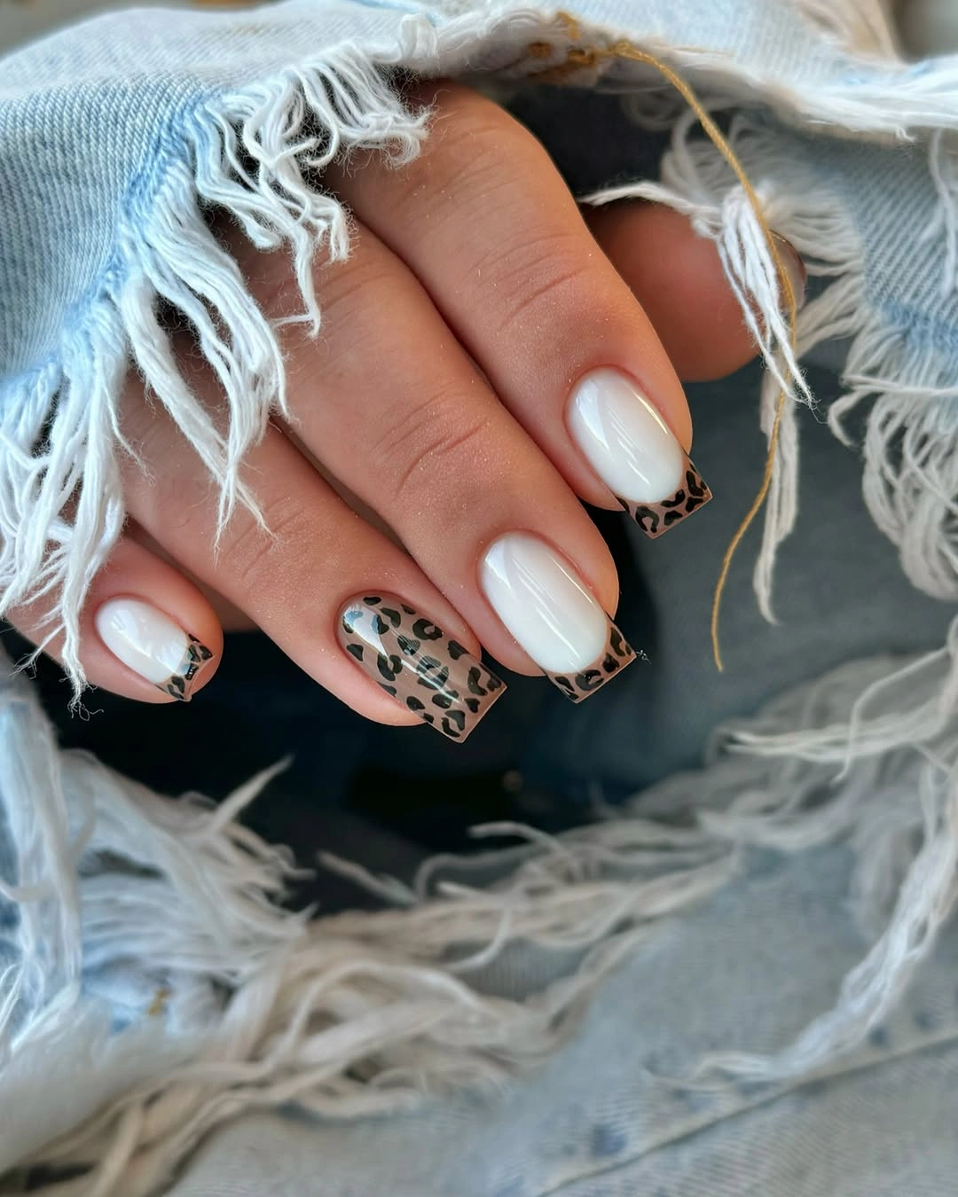 Milky white square nails with small spotted accents