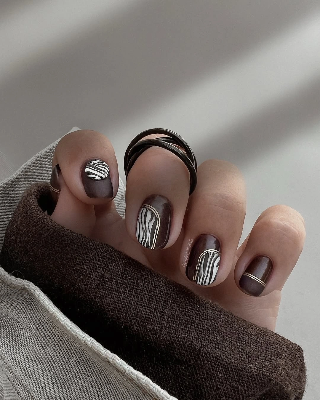 Brown black square nails with fine light linework