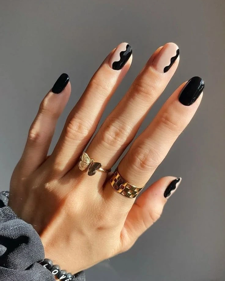 Red and nude almond nails with small white hearts
