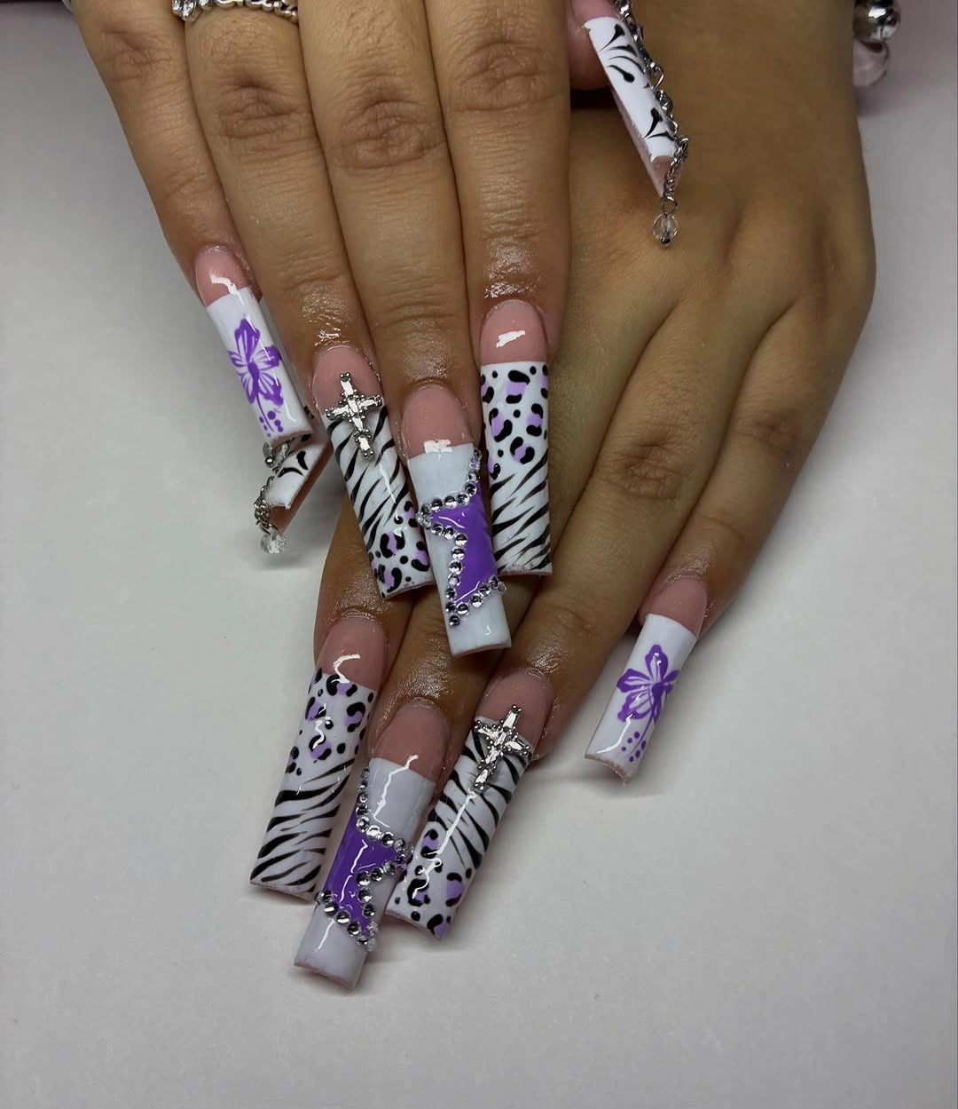 Long square lavender nails with mixed animal prints