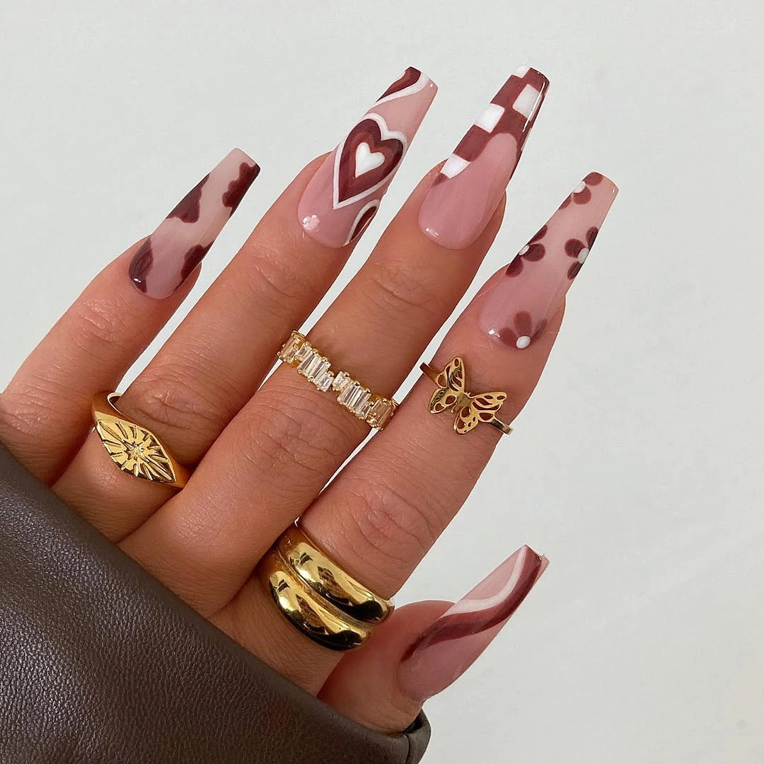 Long square pink nails with burgundy spots and heart