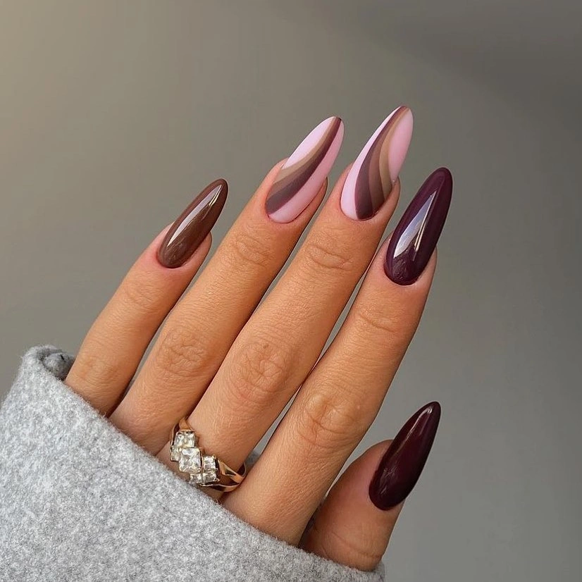 Long almond chocolate plum nails with curved panels