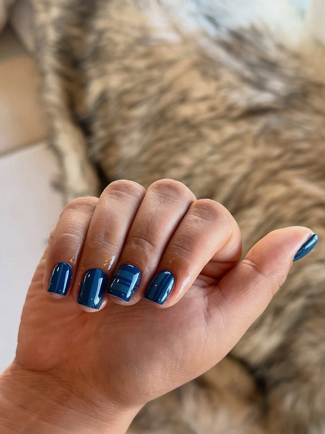 Short square navy nails with subtle blue bands