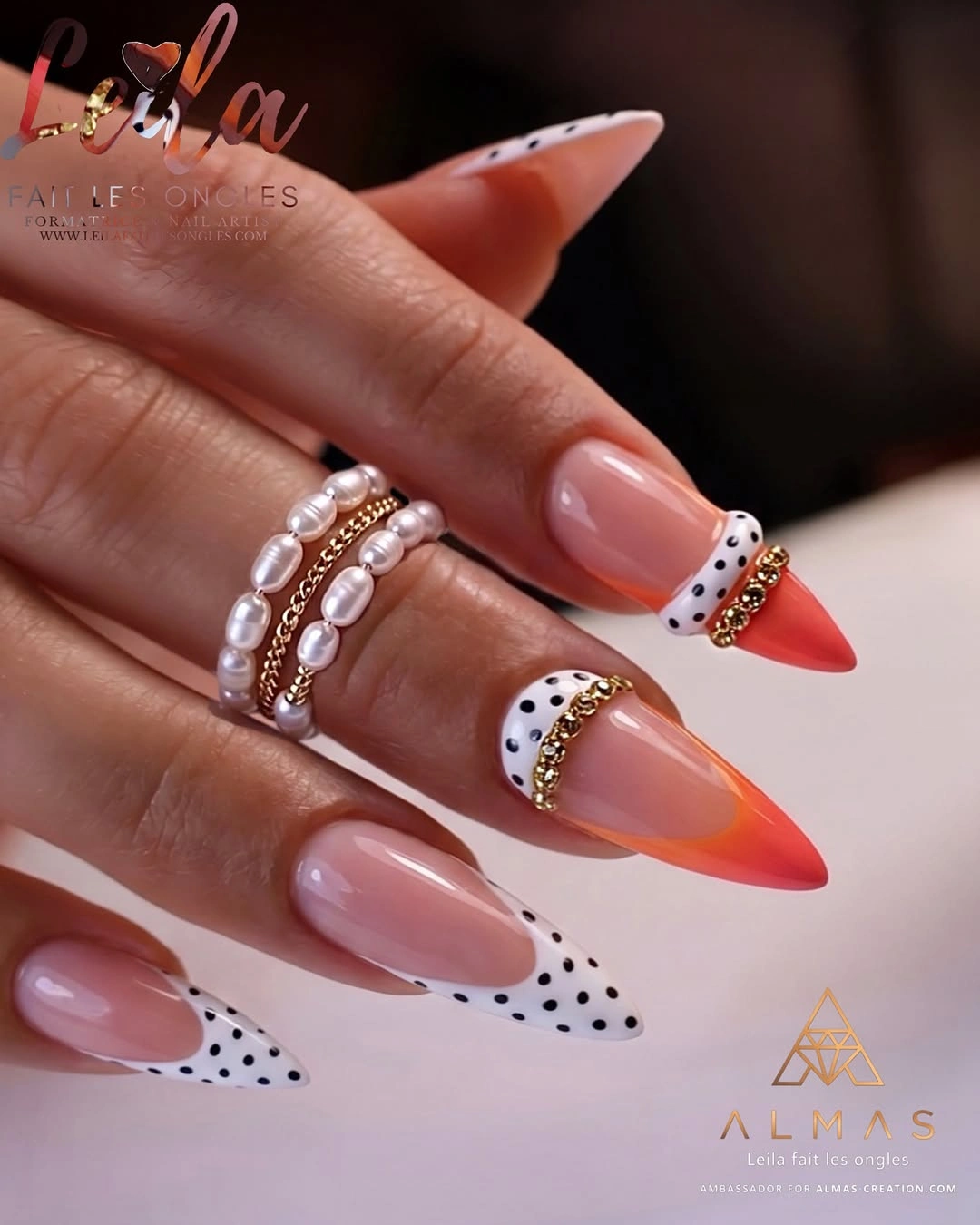 Long almond nails with dotted and orange red tips