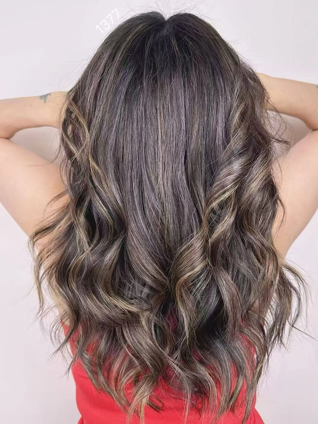 Long wavy brown hair with cool gray-brown ribbons and volume