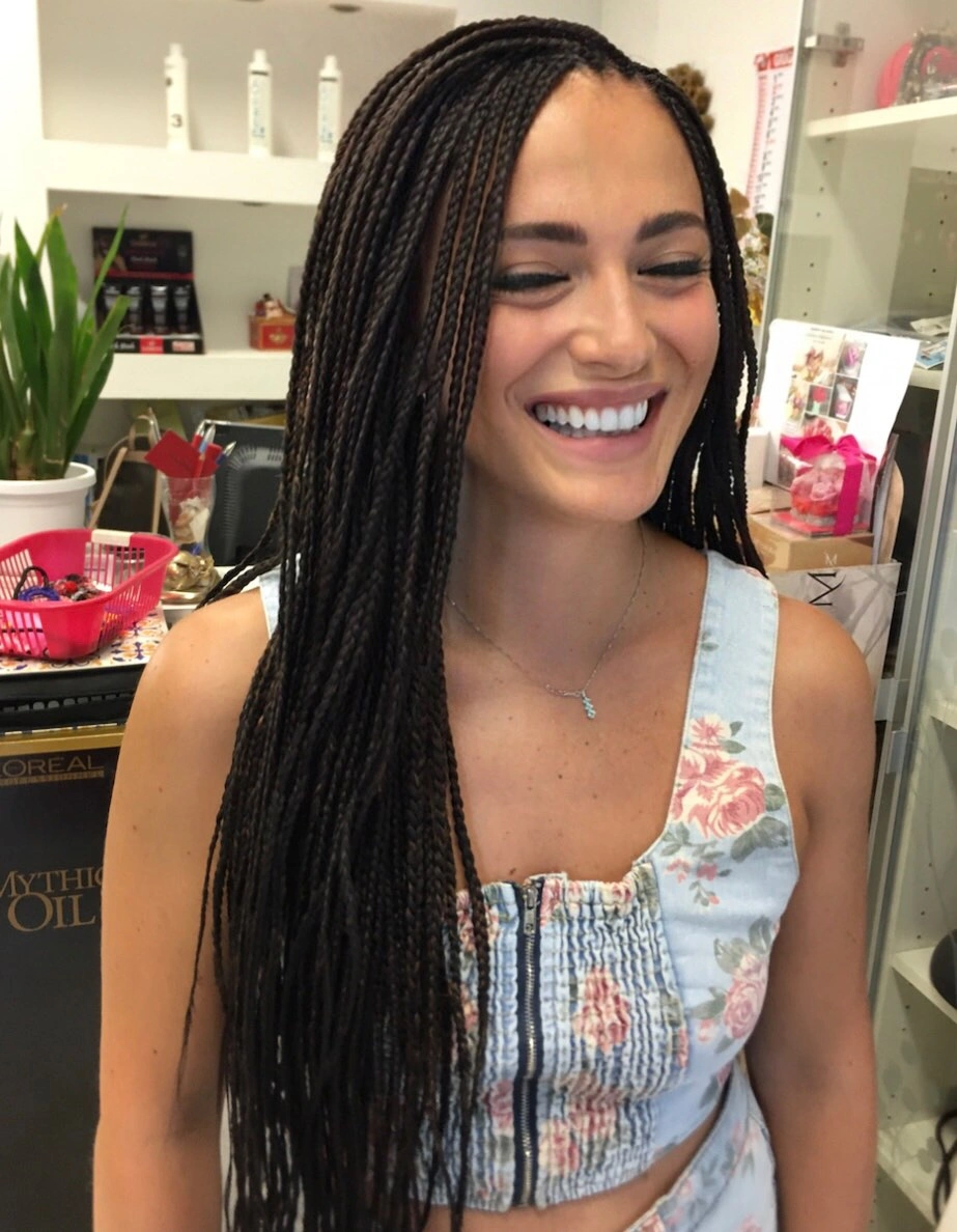 Very long dark brown-black braids creating dense vertical texture