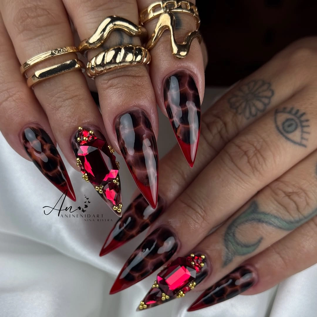 long stiletto nails with smoky burgundy marble and bright accents