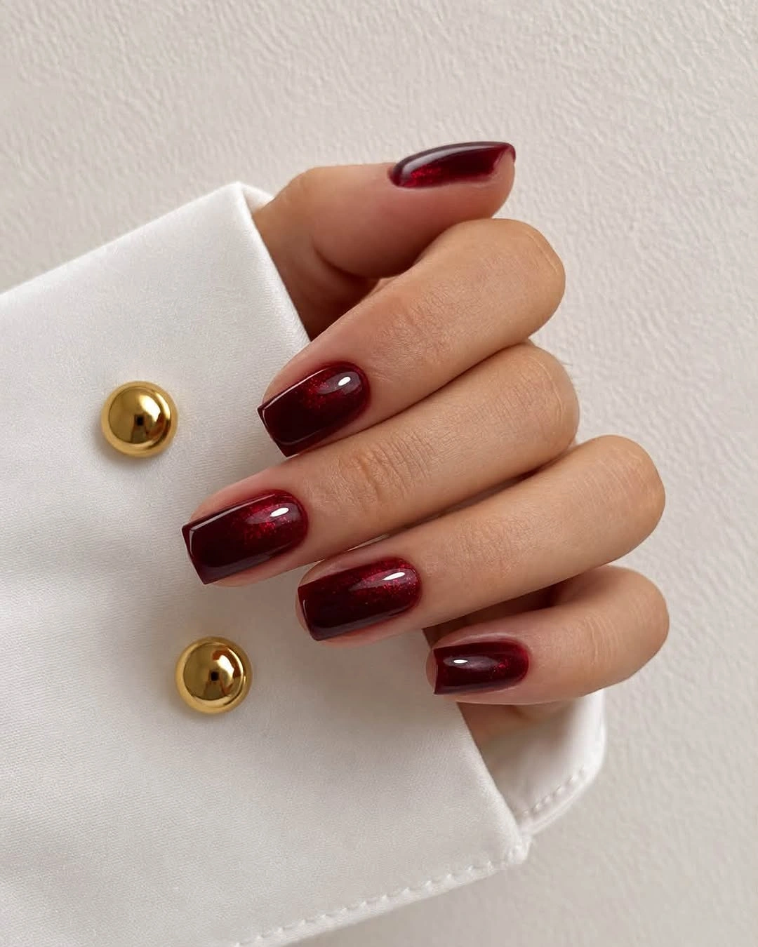 short square nails in deep glossy burgundy