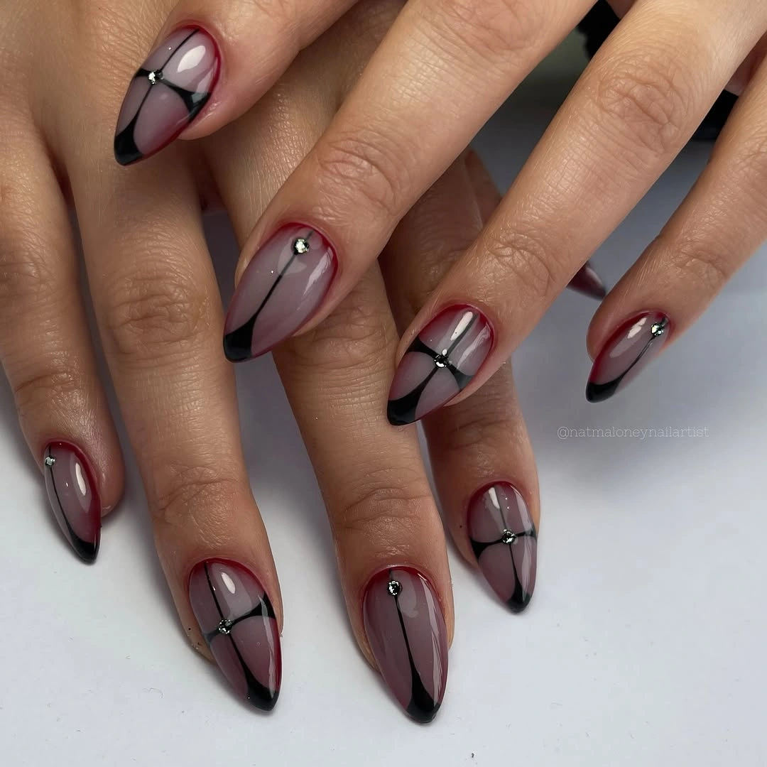 mauve almond nails with black diagonal details
