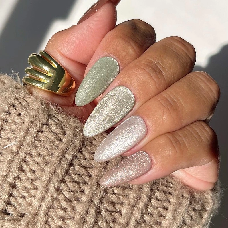 Long almond nails with a pearly taupe neutral reflective finish