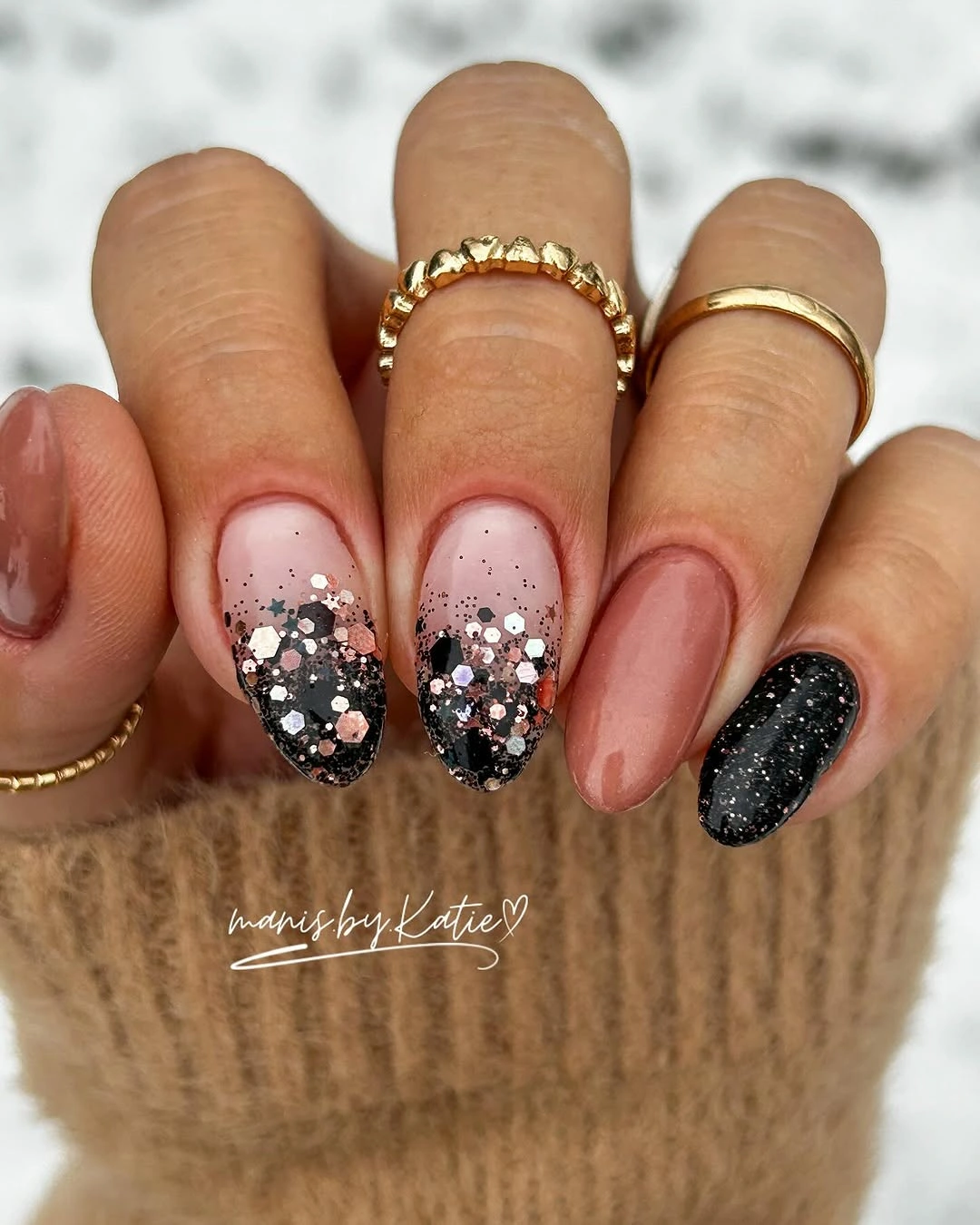 Dusty pink almond nails with black white and glittered accent details