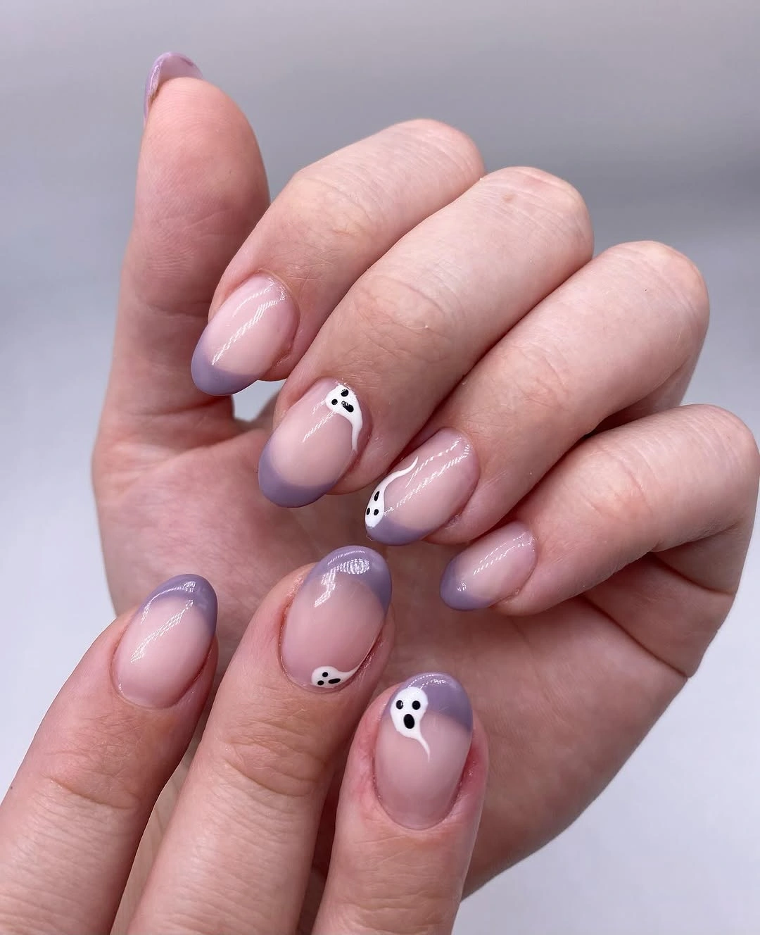 Short almond lavender pink nails with tiny black and white accents