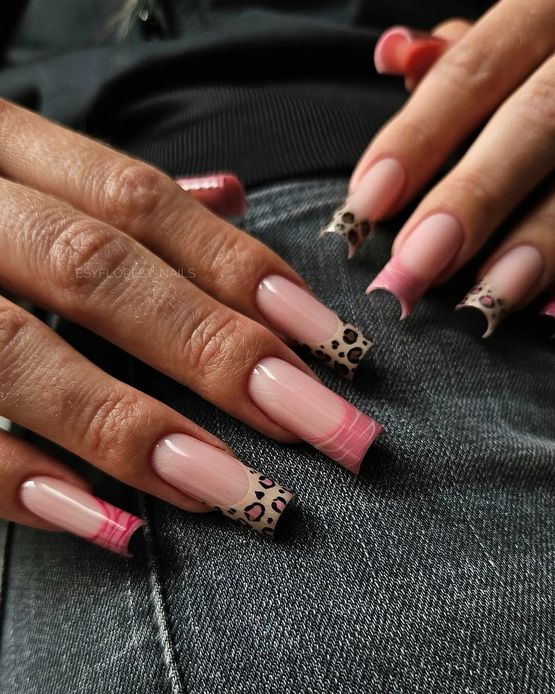 Long square pink French nails with black and white spotted tips