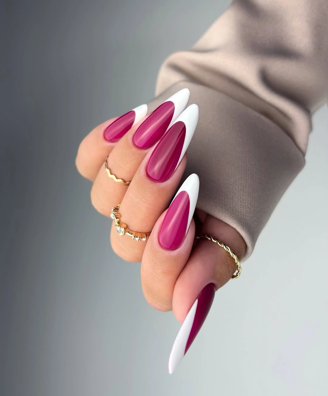 Long stiletto nails with white and magenta diagonal French panels