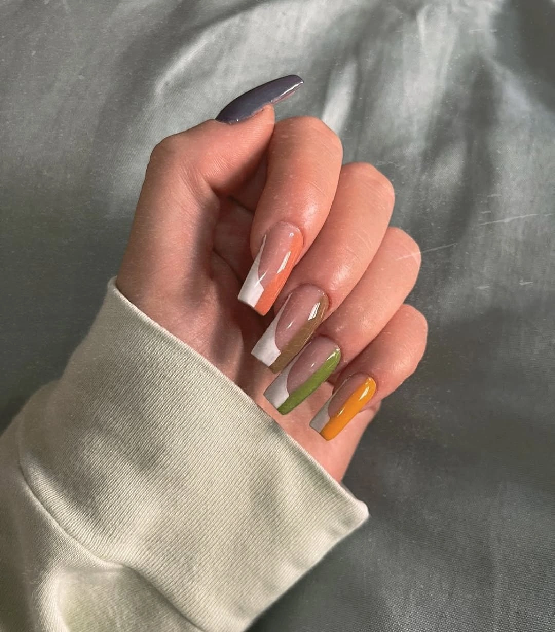 Medium square nails with peach sage and orange French tips