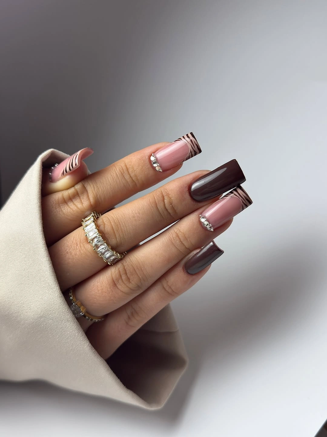 Brown square nails with blush panels and metallic trim