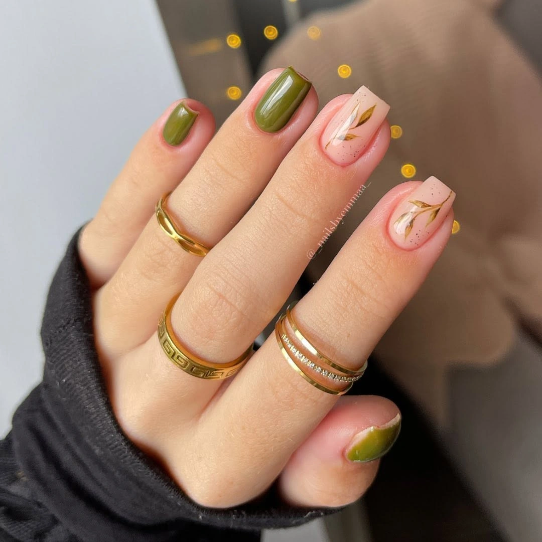 Olive rounded nails with pink and tiny botanical marks
