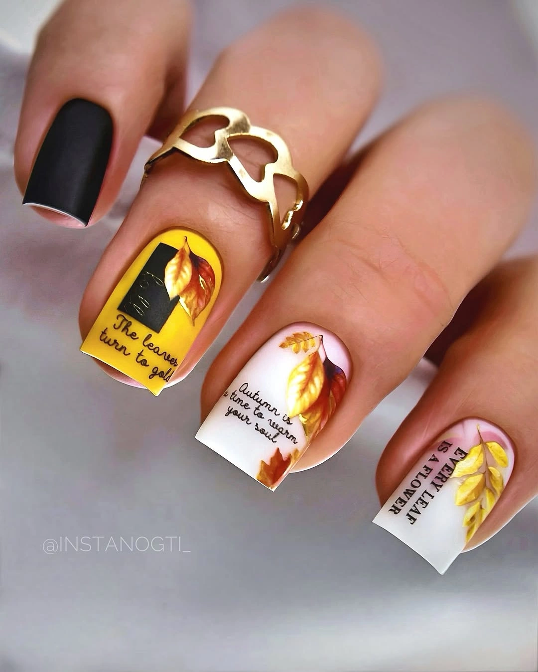 Yellow orange square nails with graphic dark marks and panels