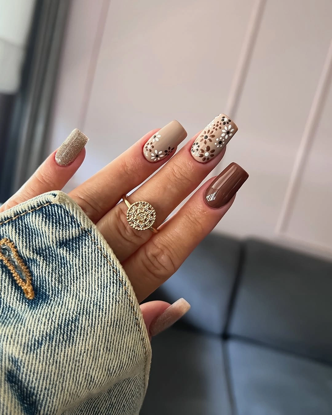 Warm beige brown nails with small spotted glitter accents