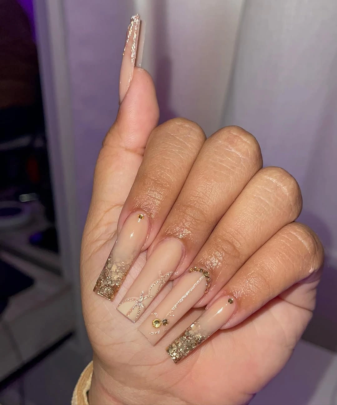 Long red French square nails with zebra panels and tiny colorful accents