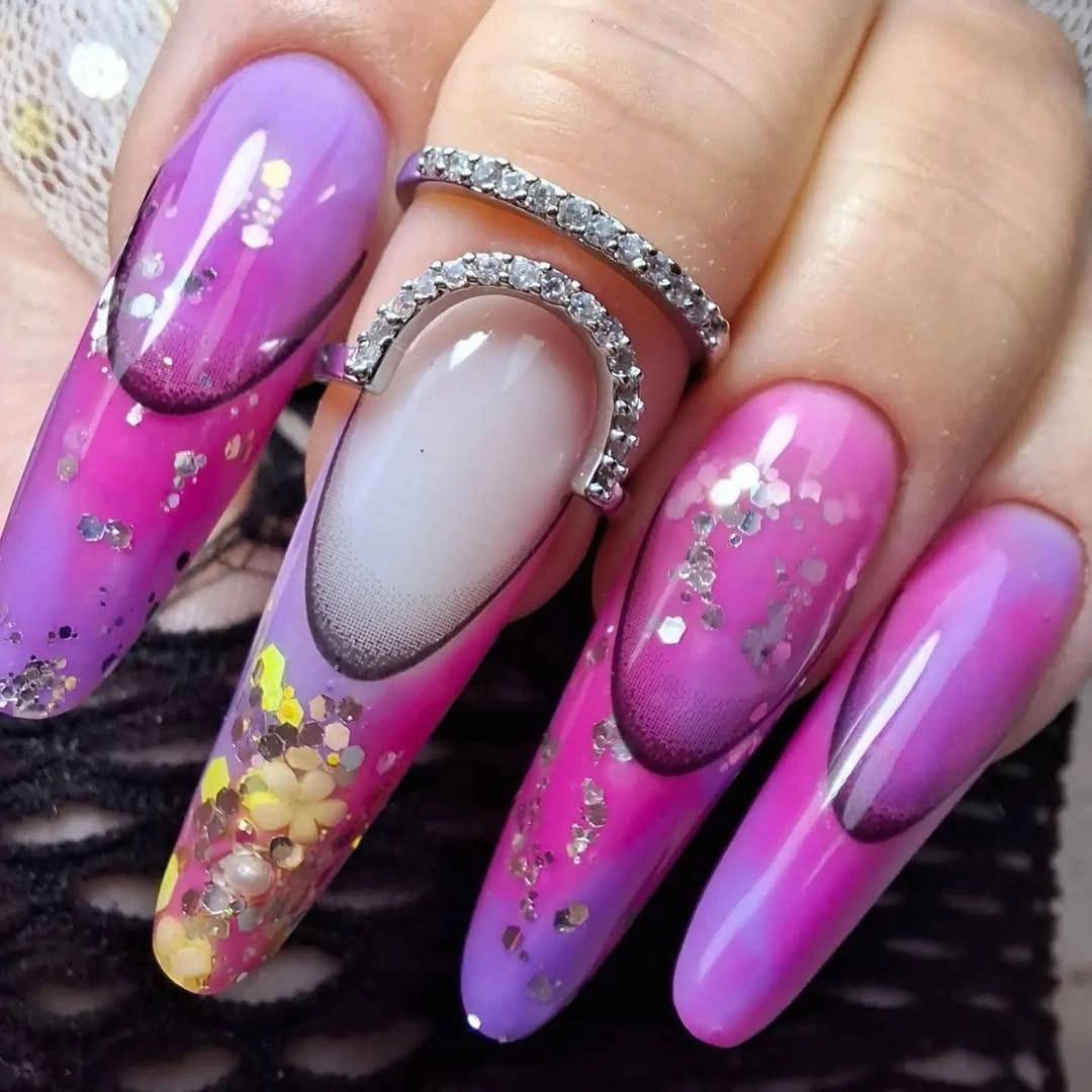Long coffin nails with amber marbling and delicate gold glitter tips