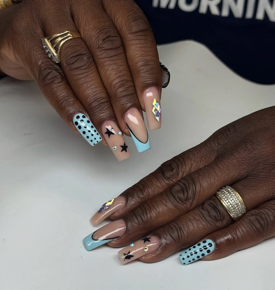 Extreme multicolor stiletto nails with neon curved accents over pink bases