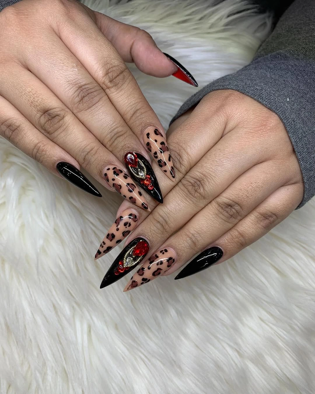 Medium almond nails with glossy blush bases and crisp white French tips
