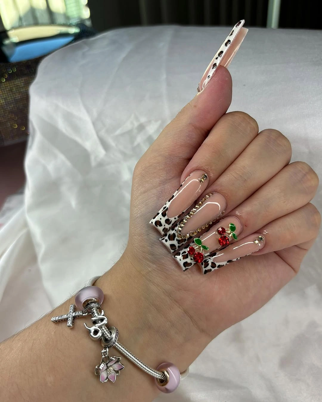 Extreme burgundy square nails with nude floral and glitter accent panels