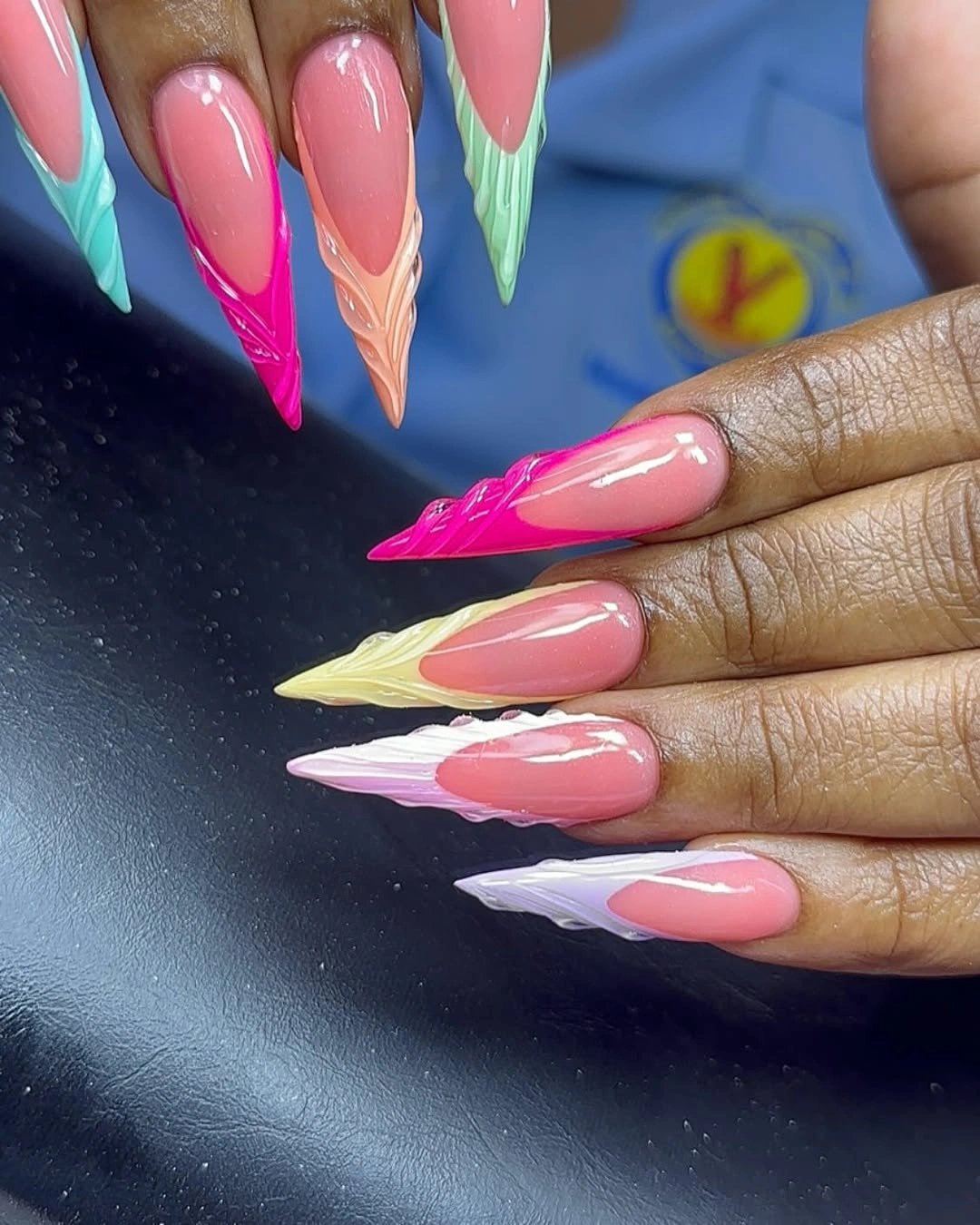 Long coffin nails with sheer nude pink bases and fine glittered tips