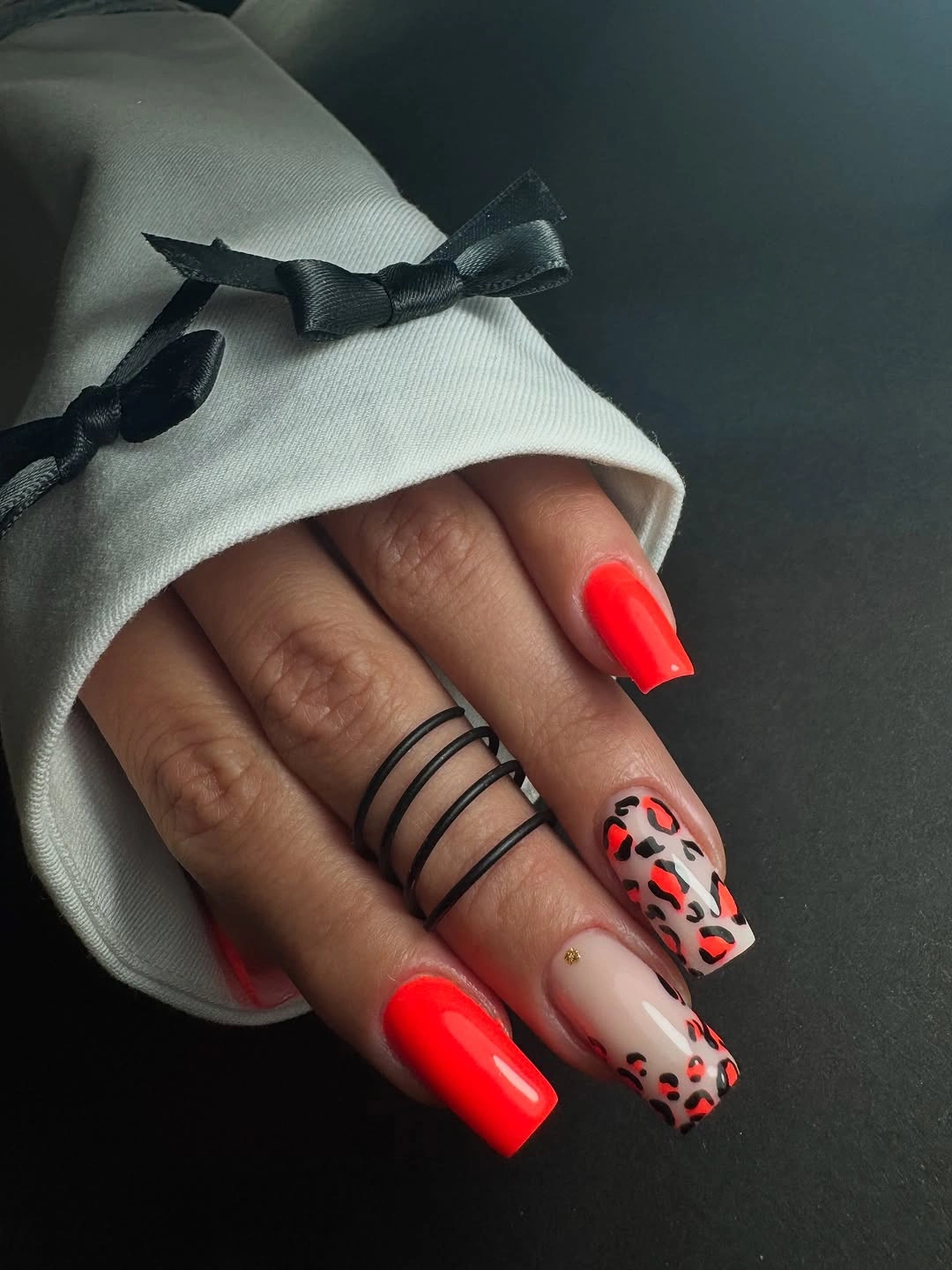 Very long lavender square nails with leopard print French edges