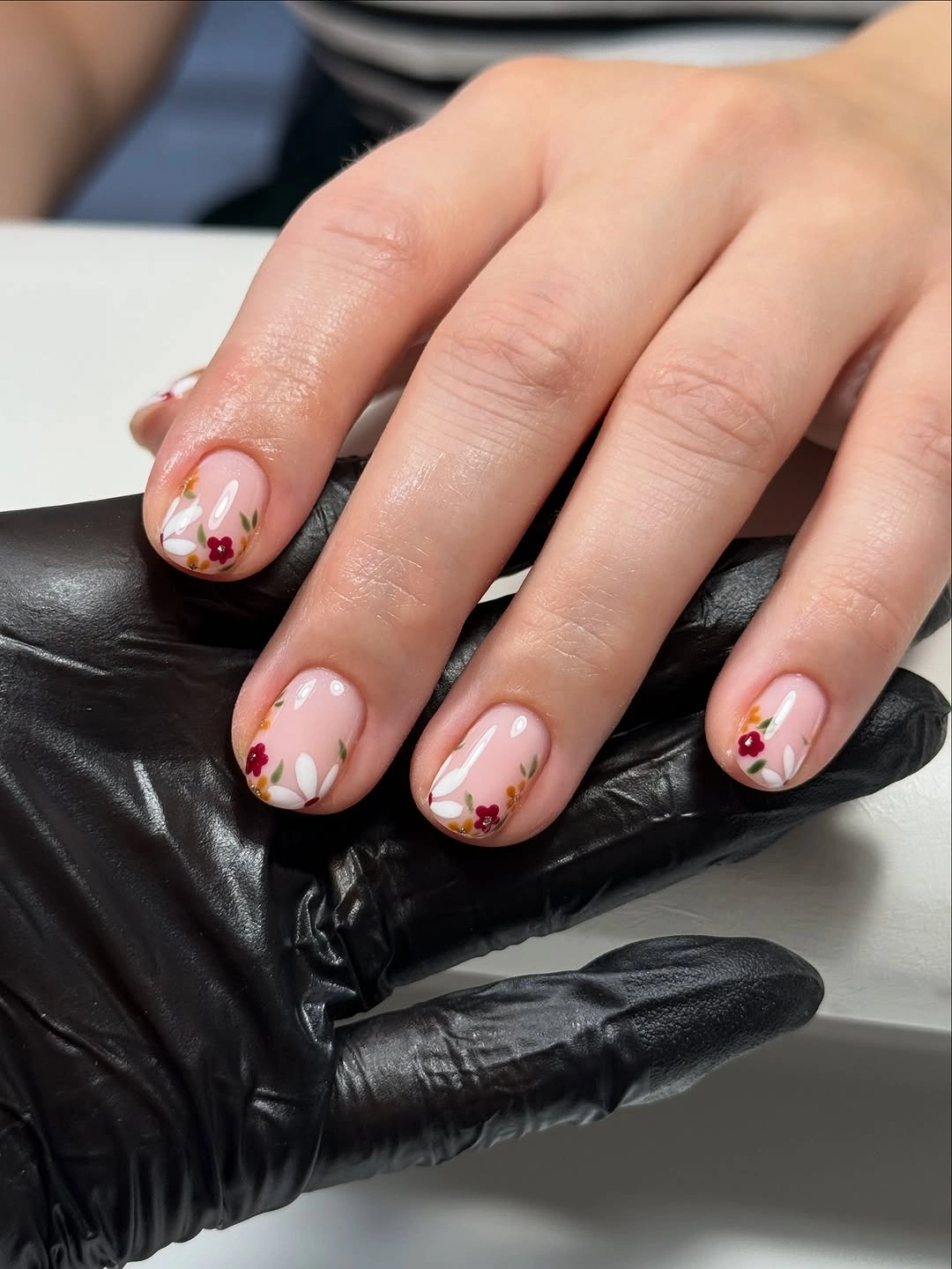 Very short pink nails with tiny fall florals