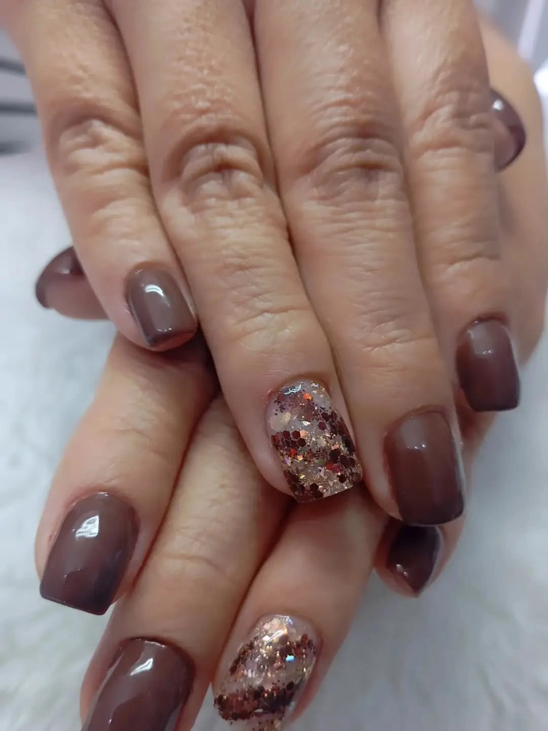 Taupe brown short nails with chunky glitter accents