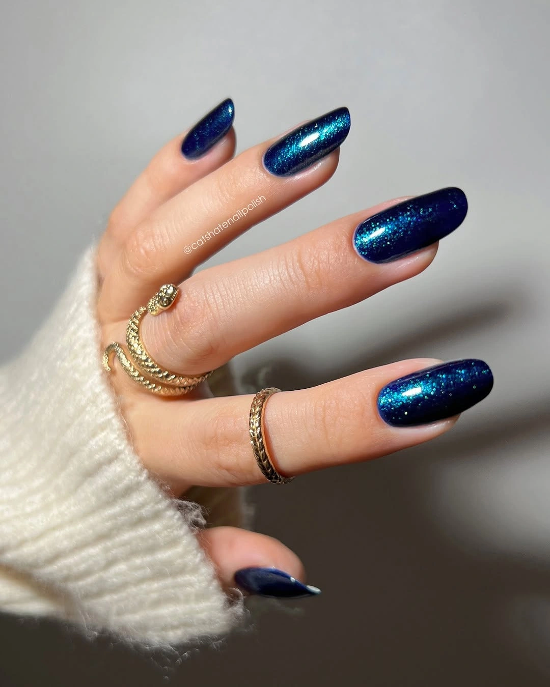 Navy oval nails with teal blue shimmer