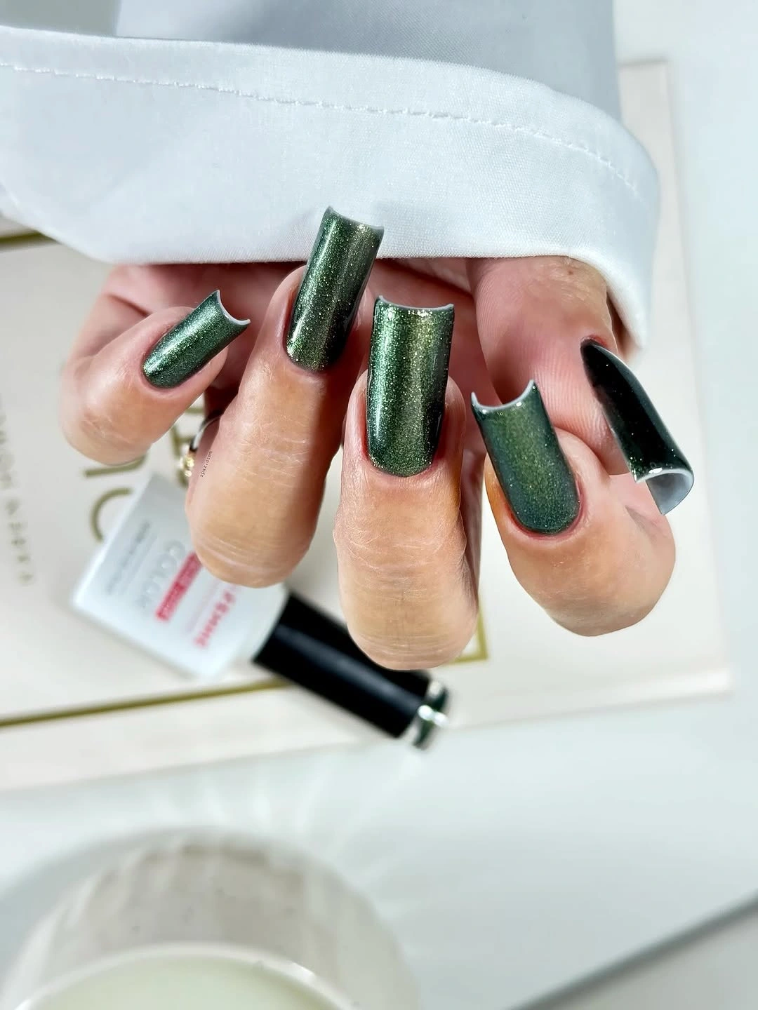 Emerald chrome square nails with dark accent fingers