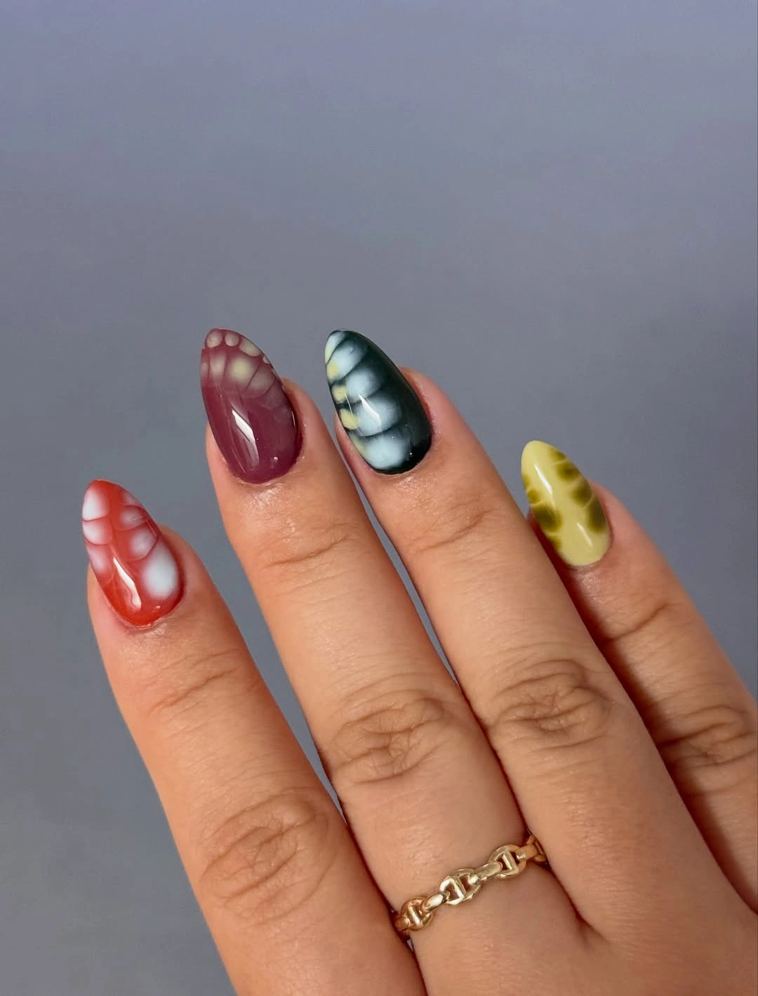 Burgundy teal yellow and terracotta mixed fall nails