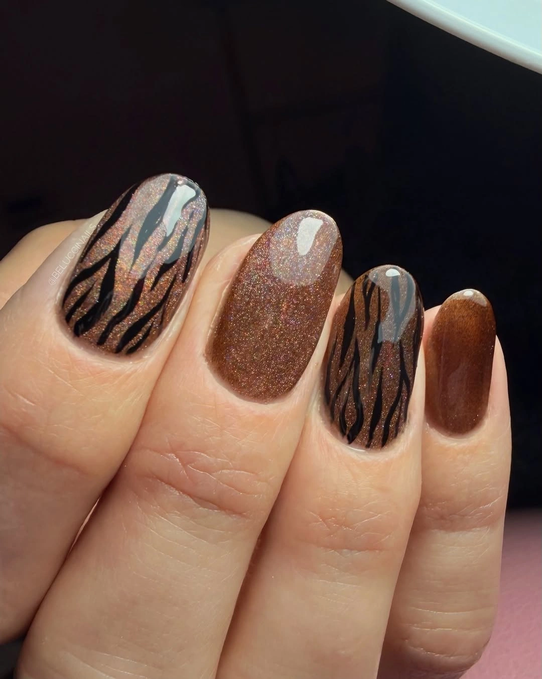 Brown taupe nails with zebra-like dark line accents