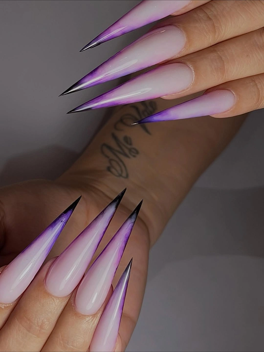 Lilac pink ombre stiletto nails with purple edges